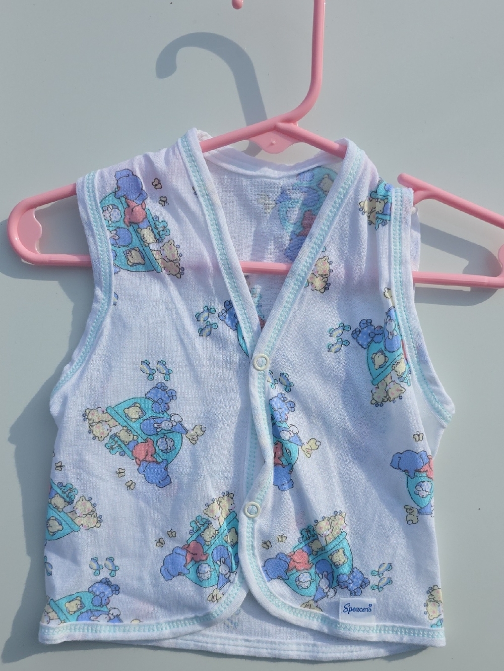 Spencer's White Baby Vest with Blue and Pink Cartoon Print